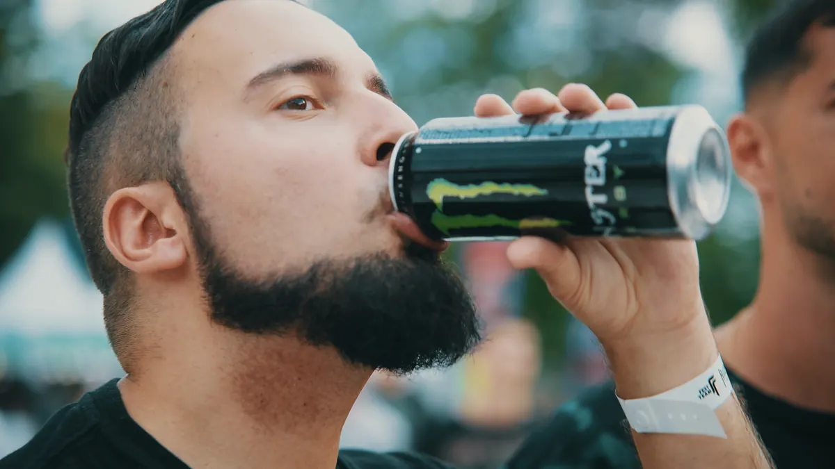 A fan drinking Monster Energy at the festival