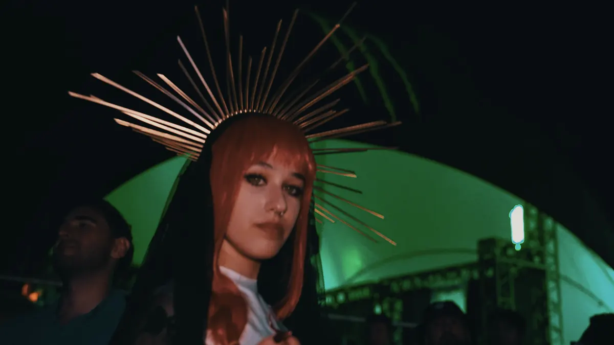 Girl with a halo headpiece in the green Monster Energy tent