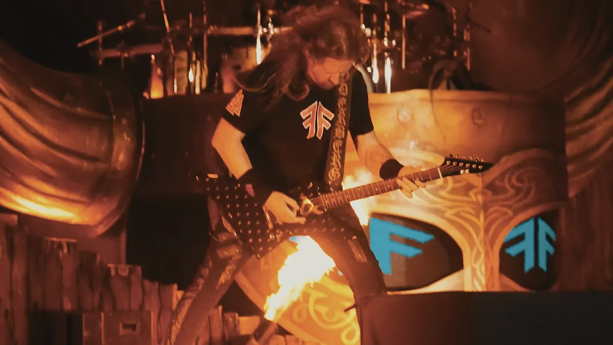 Guitarist and fire on stage