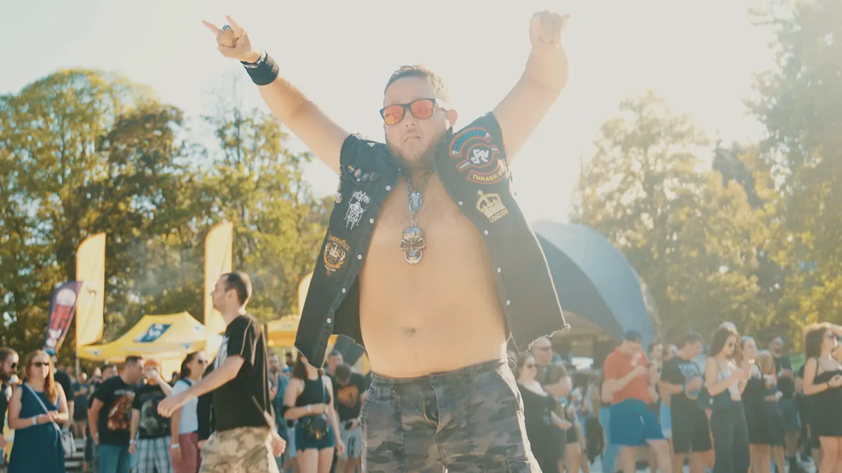 Fan with raised arms at Hills of Rock